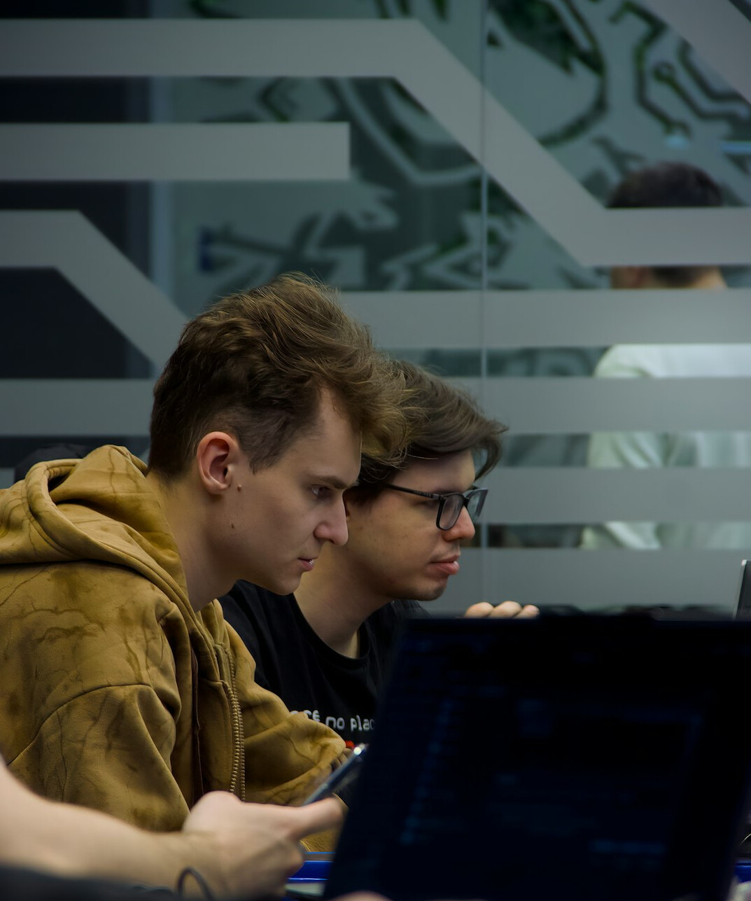 students reviewing code on screen