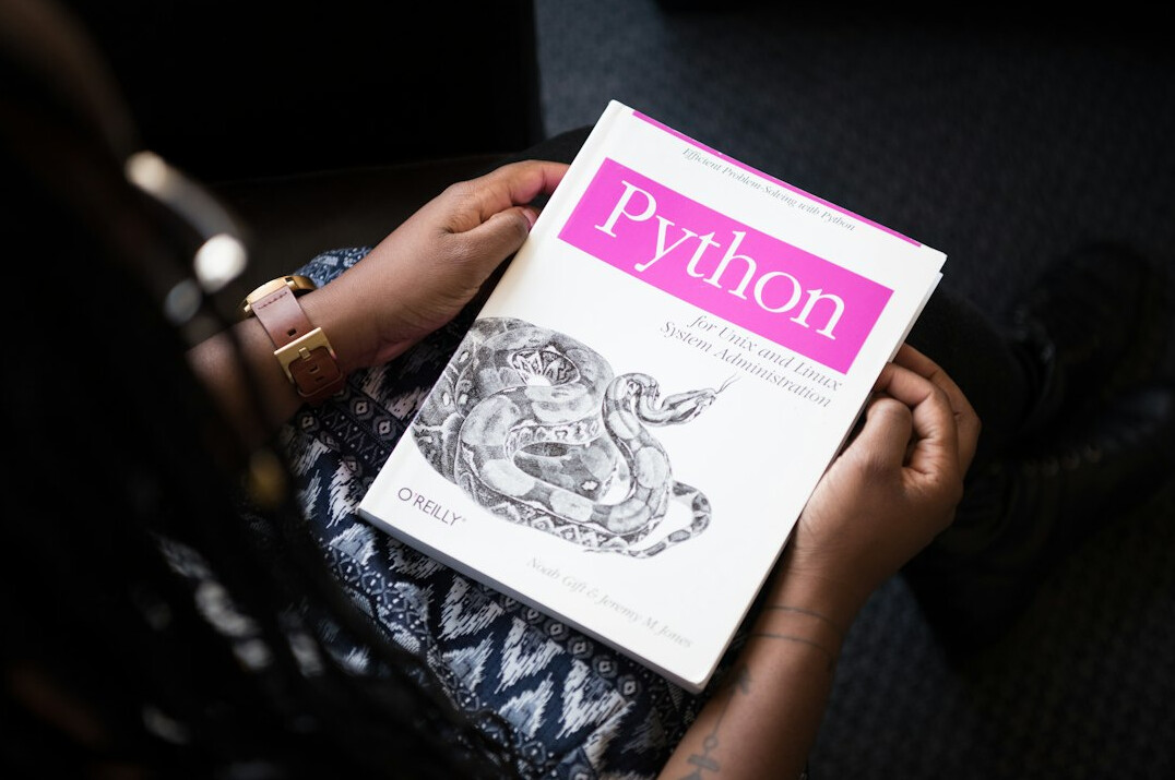 student reading coding book