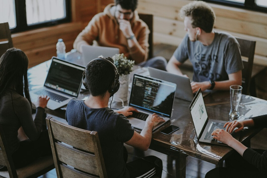 group of developers discussing code